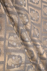 Close-up of patterned fabric with gold and brown design