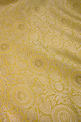 Yellow banarasi silk fabric with intricate floral weaving