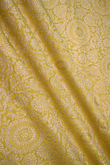 Yellow banarasi silk fabric with intricate floral weaving