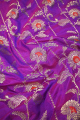 Purple Banarasi silk fabric with floral zari woven pattern and red accents