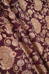 Close-up of floral patterned fabric with intricate design on a background wine