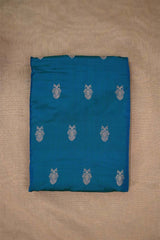 Blue Banarasi silk fabric with zari floral patterns motifs on beige background