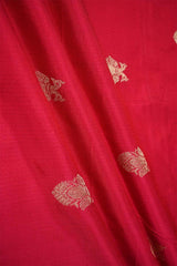 Red Banarasi Silk fabric with gold embroidered floral patterns