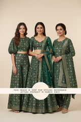 A teen, an adult and an old woman in green Banarasi Silk fabric made outfits