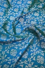 Teal Blue Banarasi Silk Fabric with Gold Zari Ikkat Weaving