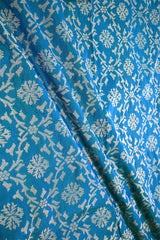 Teal Blue Banarasi Silk Fabric with Gold Zari Ikkat Weaving