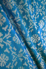 Teal Blue Banarasi Silk fabric with gold zari ikkat patterns