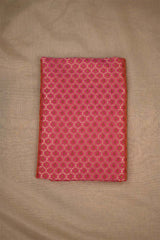 Red fabric with a geometric pattern on a beige background