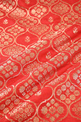 Red fabric with gold floral patterns