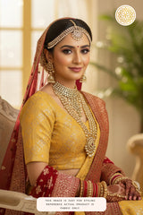 An Indian bridal in yellow Banarasi silk blouse with jewelry, indoor setting