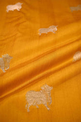 yellow fabric with embroidered sheep patterns