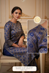 Woman wearing a blue and gold patterned outfit with an inset showing the fabric details.