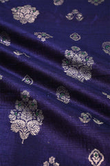 Navy blue fabric with silver floral patterns