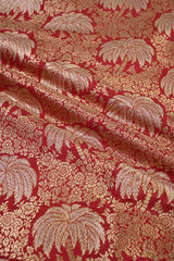Textile with gold leaf pattern on a red background