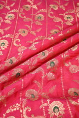 Rani Pink fabric with rich gold zari floral motifs and fine meenakari.