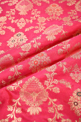 Close-up of Shimmer Pink fabric with gold zari floral motifs.