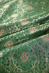 Close-up of green patterned fabric with pink flowers