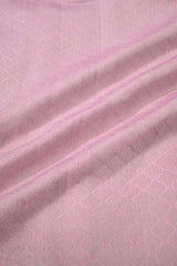 Close-up of pink quilted fabric showcasing delicate geometric patterns