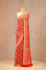 Scarlet Red Bandhej georgette khaddi silk saree with zari resham weave, shikargah motifs and gharchola pallu