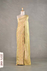 Light green saree on a mannequin against a gray background with a discount label.