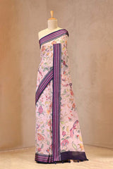 Pink Saree with floral pattern on a mannequin against a plain background
