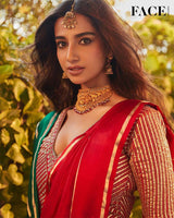 Meenakshi Chaudhary in red Banarasi silk saree in a recent wedding look