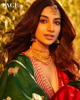 Meenakshi Chaudhary in Green Banarasi silk saree in a recent wedding look