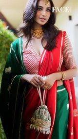 Meenakshi Chaudhary in Green Banarasi silk saree in a recent wedding look