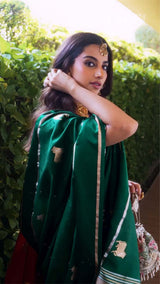 Meenakshi Chaudhary in Green Banarasi silk saree in a recent wedding look