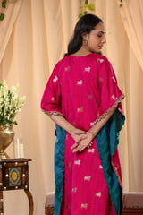 A woman in a traditional pink kaftan co-ord set, back view