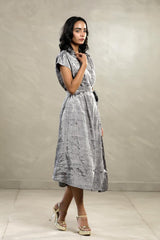 A woman in a Silver Tissue silk Party Wear Dress