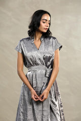 A woman in a Silver Tissue silk Party Wear Dress