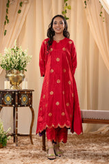 A woman in a traditional red salwar suit and red banarasi dupatta