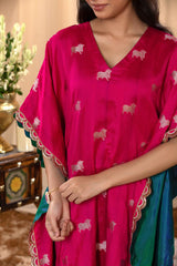 A woman in a traditional pink kaftan co-ord set, close view