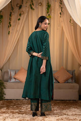 A woman in a green traditional Kurti co-ord set standing. green Wedding Kurti Salwar Suit