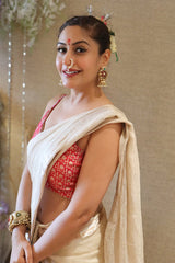 Surbhi Chandna in an off white tissue silk Banarasi saree and pink blouse