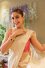 Surbhi Chandna in an off white tissue silk Banarasi saree and pink blouse