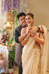 Surbhi Chandna in an off white tissue silk Banarasi saree and pink blouse