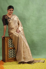 Women wearing Wedding Golden Saree having Brocade Tissue Silk Saree showing geometrical gold zari weaving, maroon piping.