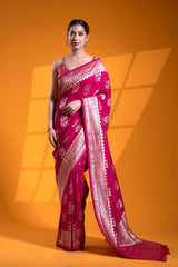 An Indian woman in a Dark Pink Banarasi Saree with Floral Motifs