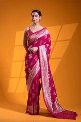 An Indian woman in a Dark Pink Banarasi Saree with Floral Motifs for wedding and festival