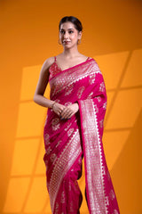 An Indian woman in a Dark Pink Banarasi Saree with Floral Motifs for wedding and festival