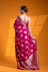 An Indian woman in a Dark Pink Banarasi Saree with Floral Motifs for wedding and festival