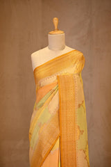 A yellow rangkat Banarasi Saree on dummy