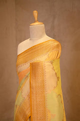 A yellow rangkat Banarasi Saree on dummy