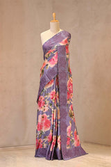 Close up of Lilac Tussar Silk Saree showing digital printed multicolor floral prints across the body and a resham woven cutwork lace border.