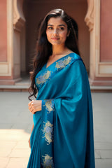 This Teal Blue Handloom Banarasi Silk Saree with Vrishabha Motifs is a wedding saree and festive wear saree. Free Shipping Available!