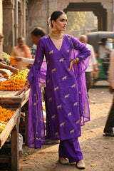 Gold zari woven ethnic ashva motif on purple Chiniya silk unstitched suit set with an embroidered organza dupatta.