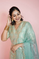 Women with Turquoise Blue Handwoven Banarasi Silk Suit Set at Chinaya Banaras