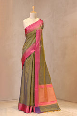 Close up of Green Banarasi Cotton Saree showing resham horizontal stripes on the body and contrasting satin border with gold zari stripes.